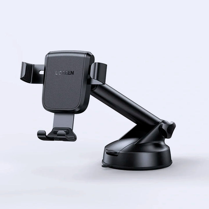Soporte de celular UGREEN por gravedad con ventosa para auto, compatible con diferentes modelos, en color negro.