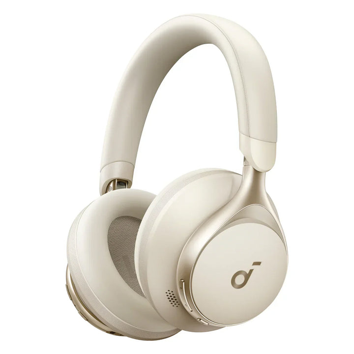 Audífonos inalámbricos Soundcore Space One en color crema, con diseño moderno y auriculares sobre la mesa.